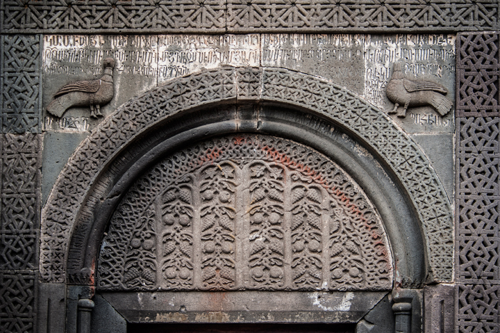 Armenian ornamental carvings at Geghard monastery, cultural tours in Armenia.